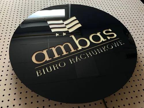 Czarne okrągłe logo biura rachunkowego Ambas