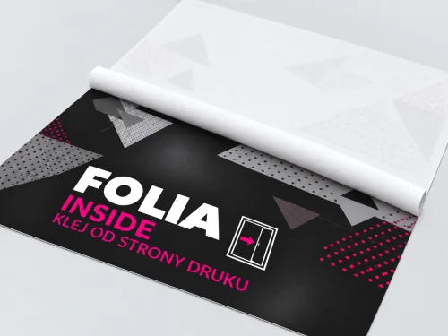 Folia Inside leżąca płasko, z linerem na całej szerokości od strony nadruku, pokrywającym górną połowę i zwiniętym w biały rulon